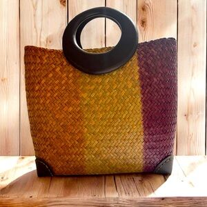 Natural bamboo woven bag with wooden handle is ideal for casual days.